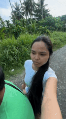 Woman records selfie video while riding scooter in Carmen