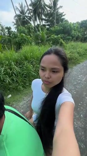 Woman records selfie video while riding scooter in Carmen