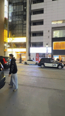 Modified luxury cars gather on Shibuya street near retail stores