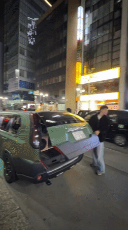 Modified luxury cars gather on Shibuya street near retail stores