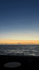 Ocean sunset viewed from ship deck, April 2026