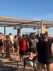 Beach day at Sant Adrià de Besòs with industrial backdrop