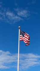 American flag flies on flagpole in Chicago
