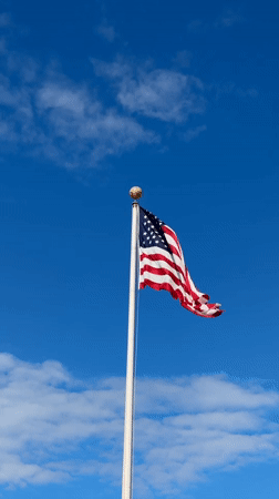 American flag flies on flagpole in Chicago