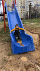 Child plays with shovel at muddy playground in Cheboksary