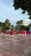 Coordinated dance group performs in red uniforms in Đà Nẵng