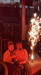 Couple watches outdoor performance in Terrassa, Spain