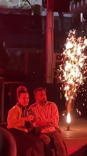 Couple watches outdoor performance in Terrassa, Spain