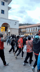 Evening life in Cusco captured through tourist and local activities