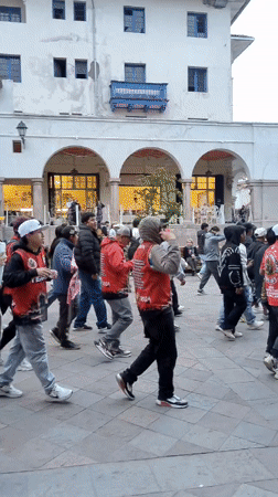 Evening life in Cusco captured through tourist and local activities