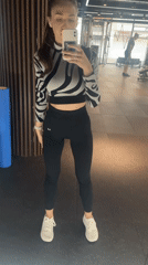 Woman documents gym visit with mirror selfies in Sofia
