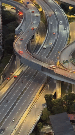 Evening traffic flows through Kuala Lumpur highway interchange