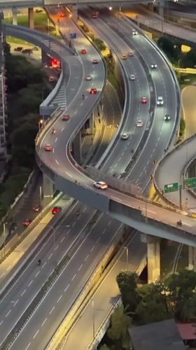 Evening traffic flows through Kuala Lumpur highway interchange