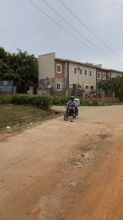 Everyday street life documented across Abuja neighborhoods