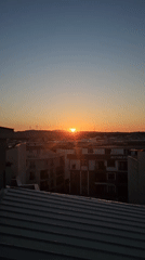 Time-lapse captures sunset over urban landscape June 1