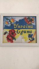 Daily life moments captured in Kherson featuring patriotic art, bicycle