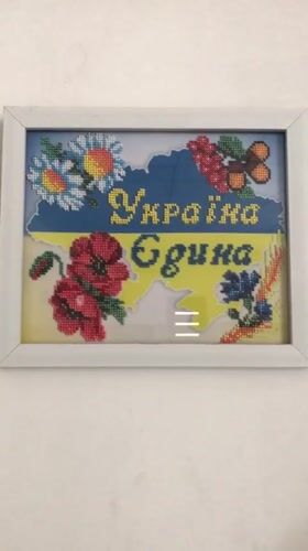 Daily life moments captured in Kherson featuring patriotic art, bicycle