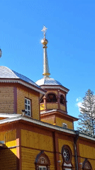 Listvyanka gardens and Orthodox church in late summer bloom