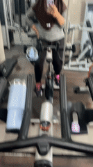 Gym mirror selfies on a stationary bike in Sidoarjo