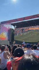 Outdoor crowd watches live soccer on a big screen in NYC