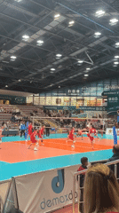 Indoor volleyball match captured at arena May 9