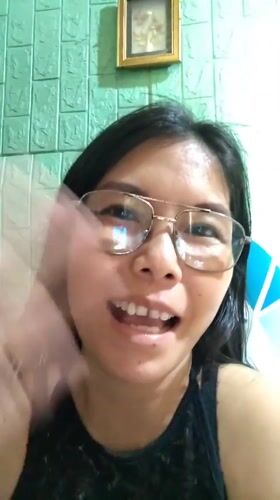 Woman recorded indoors at residential location in Philippines