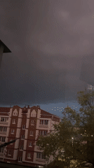 Nighttime window observations capture stormy evening scenes and indoor portrait