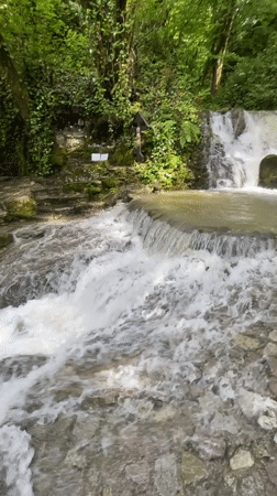 Tourist visits Russian Orthodox monastery, documents waterfalls and gardens