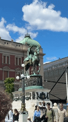 Street musician performs violin in Belgrade's Republic Square