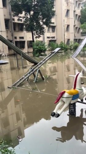 Flooding submerges playground equipment in Dhaka residential area