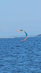 Kitesurfing off Denpasar on a bright, choppy morning