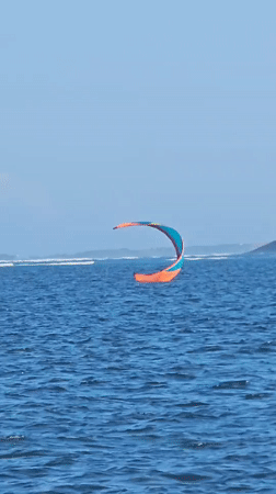 Kitesurfing off Denpasar on a bright, choppy morning