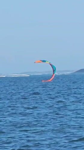 Kitesurfing off Denpasar on a bright, choppy morning