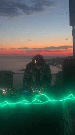 DJ performs mountaintop set, beachgoer relaxes in Montenegro coastal area