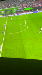 Nigerians watch Crystal Palace soccer match on television screens