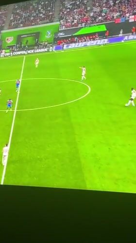 Nigerians watch Crystal Palace soccer match on television screens
