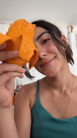 Woman enjoys mango snack in Puebla, Mexico