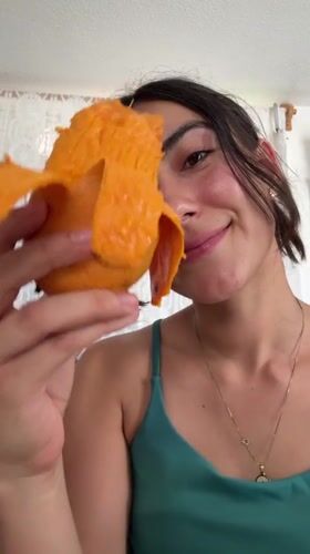 Woman enjoys mango snack in Puebla, Mexico