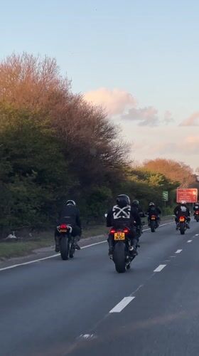 Motorcyclists ride in formation on highway near Orsett