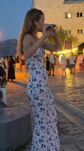 Flute performance at dusk on Budva's waterfront promenade
