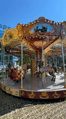 Families enjoy sunny day at Russian amusement park rides