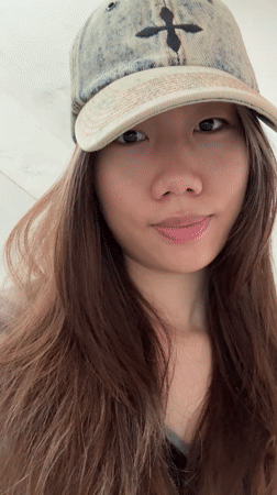 Woman spotted standing indoors in Chongqing holding plastic bag