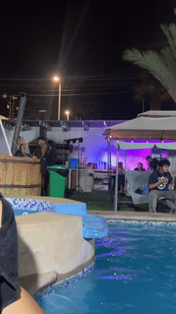 Late night pool party with food in Arica, Chile
