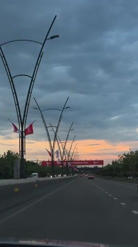 Driver captures highway journey through Tbilisi under mixed skies