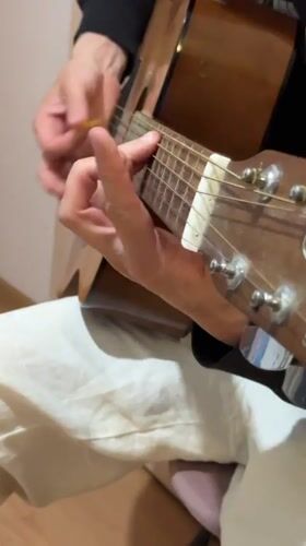 Acoustic guitar being played in Belyye Stolby, Russia