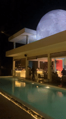 Evening gathering at moonlit restaurant venue in Midigama