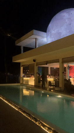Evening gathering at moonlit restaurant venue in Midigama