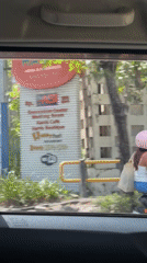 Two people spotted on scooter in Kuta street scene