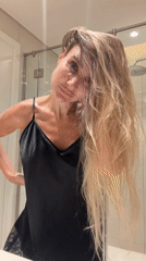 Morning hair routine in a Dubai bathroom