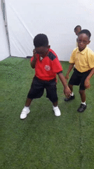School children dance with teachers in Lagos area